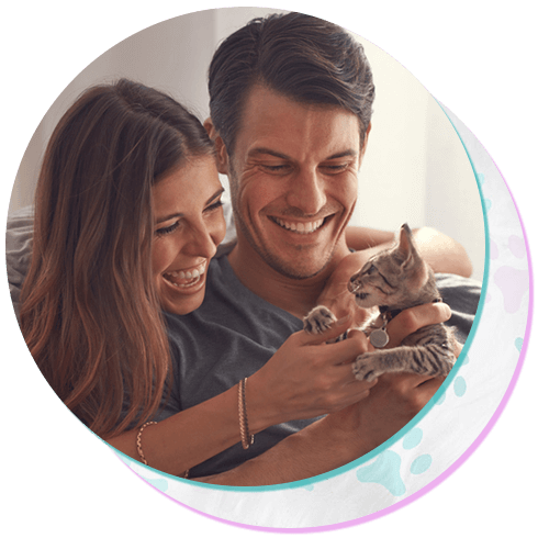 young couple sitting with their kitten